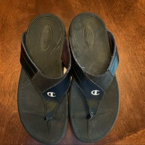 Black Champion women’s flip flop sandals. Comfortable soft and support your feet